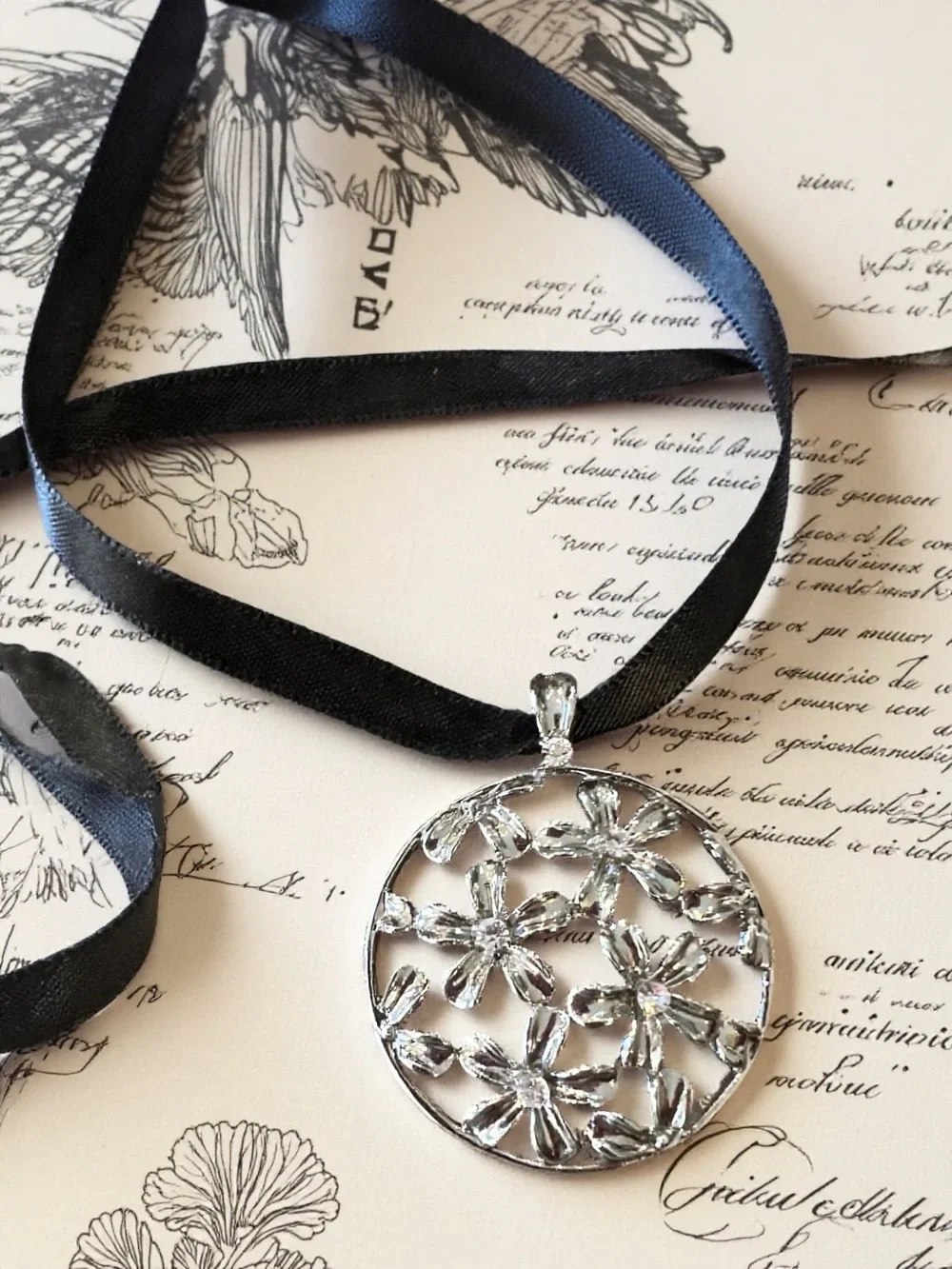 Silver Toned Floral Cutout Pendant Necklace on Black Satin Ribbon